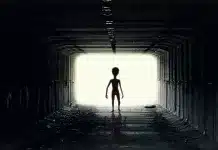 An alien coming into a dark tunnel